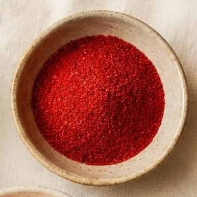 Red chilli powder in a ceramic bowl